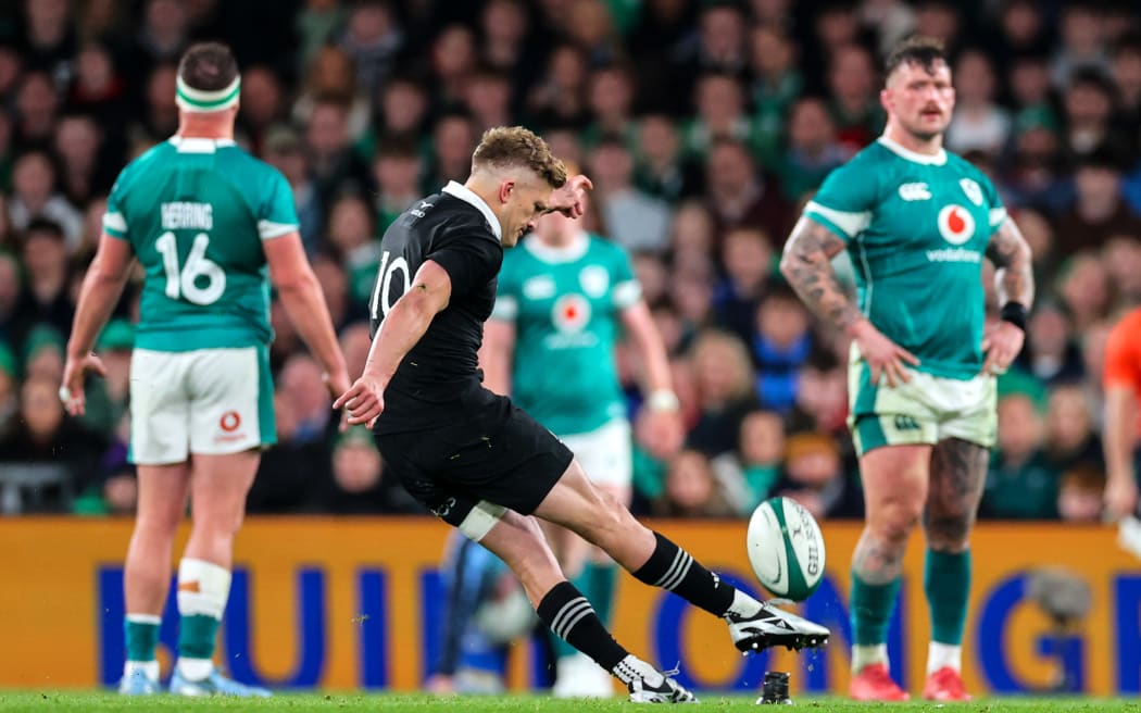 New Zealand’s Damian McKenzie kicks a penalty against Ireland.