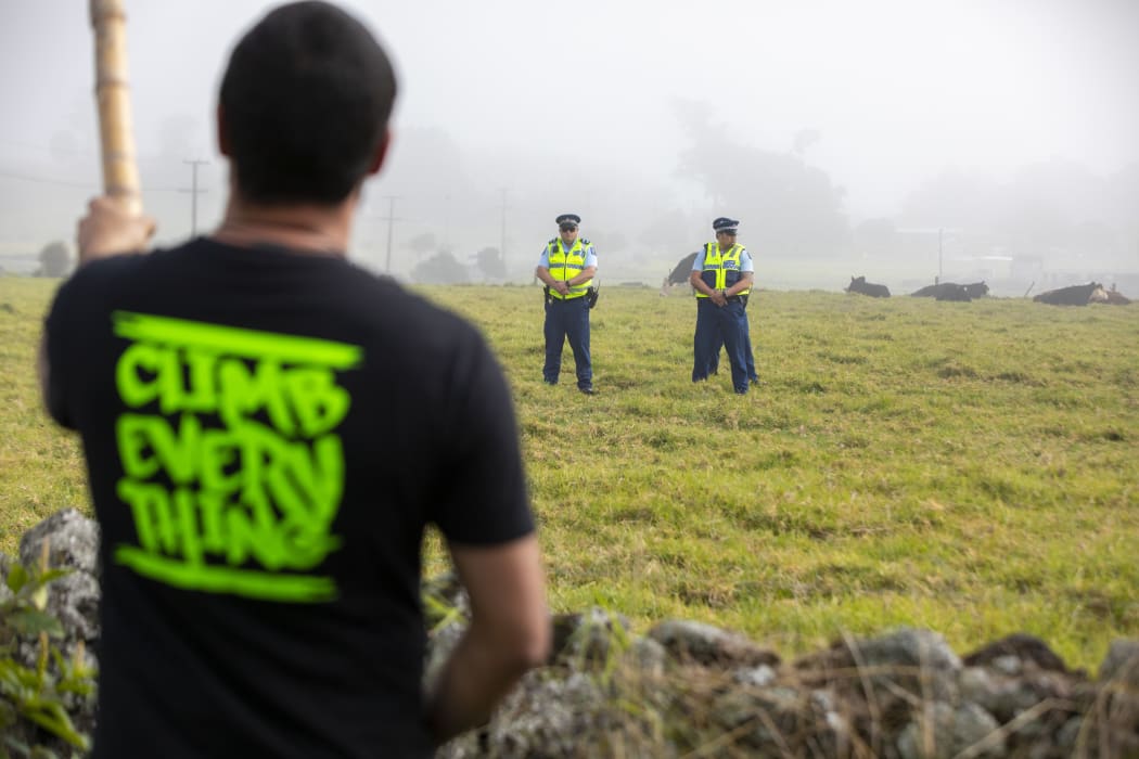 Protester and police at Ihumatao.