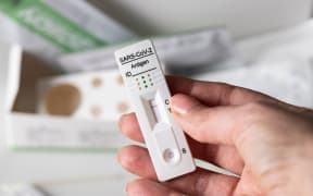 Female hand holding   Covid-19 rapid antigen diagnostic device with negative result. Self testing  and be safe concept