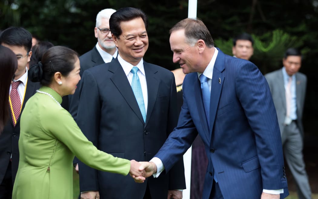 Vietnamese Prime Minister Nguyen Tan Dung and his wife, being greeted by Prime Minister John Key.