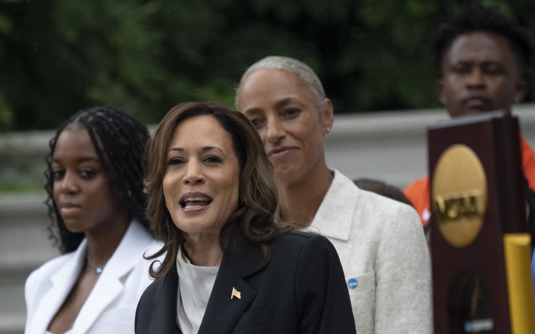 US Vice President Kamala Harris speaks during an event honoring National Collegiate Athletic Association (NCAA) championship teams from the 2023-2024 season, on the South Lawn of the White House in Washington, DC, on July 22, 2024. Joe Biden on July 21, 2024 dropped out of the US presidential election and endorsed Vice President Kamala Harris as the Democratic Party's new nominee, in a stunning move that upends an already extraordinary 2024 race for the White House. Biden, 81, said he was acting in the "best interest of my party and the country" by bowing to weeks of pressure after a disastrous June debate against Donald Trump stoked worries about his age and mental fitness.