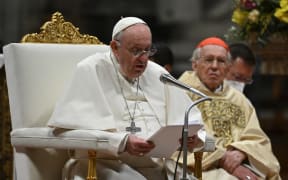 Pope Francis delivers the homily next to Italian Cardinal Giovanni Battista Re, during the Easter Vigil mass on April 16, 2022 at St. Peter's Basilica in The Vatican.