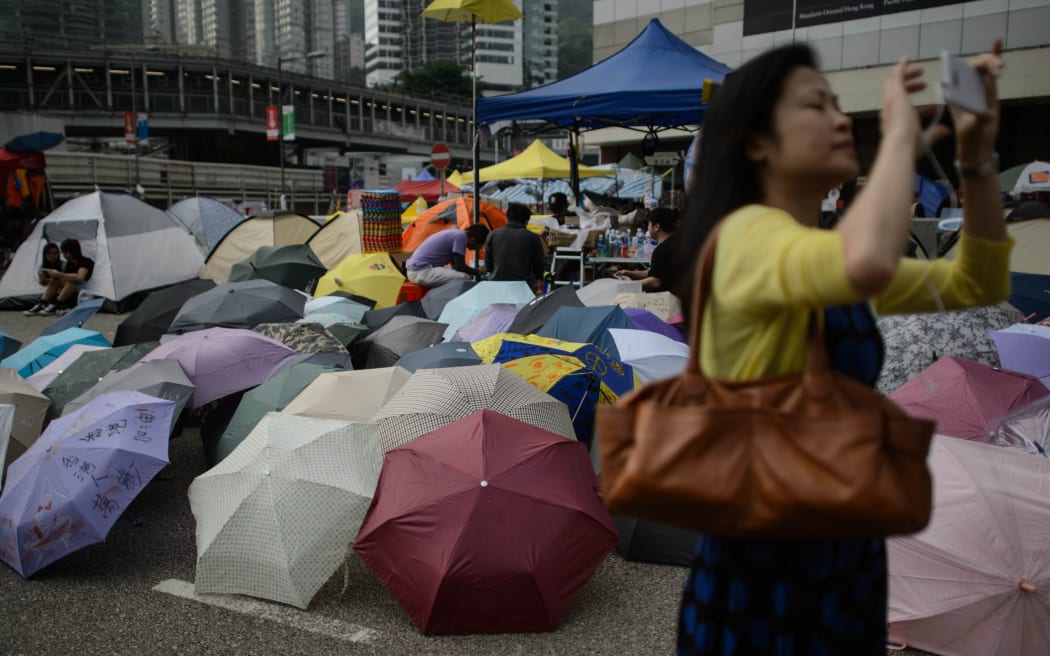 A pile of umbrellas on a road occupied by pro-democracy protesters in the Admiralty district of Hong Kong.