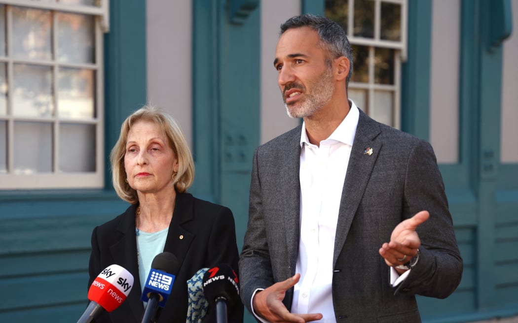 Executive Council of Australian Jewry president Jillian Segal (L) reacts as she stands next to the co-CEO Alex Ryvchin as he speaks during a media conference in Sydney on October 9, 2023. Countries around the world have reacted to a wave of attacks by land, sea and air carried out by Palestinian armed group Hamas that Israel says has claimed more than 700 lives.