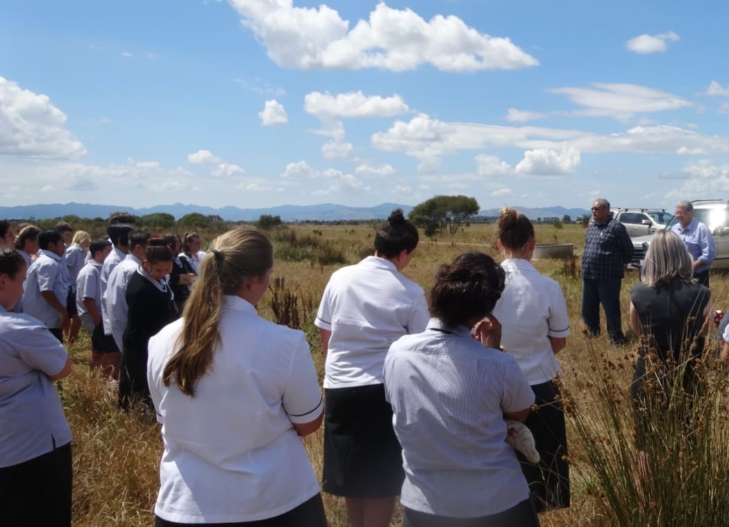 Pare Hauraki iwi representative Waati Ngamane and director John McEnteer, and Hauraki Plains College students, launch Project Papatuanuku on Pouarua Farm.