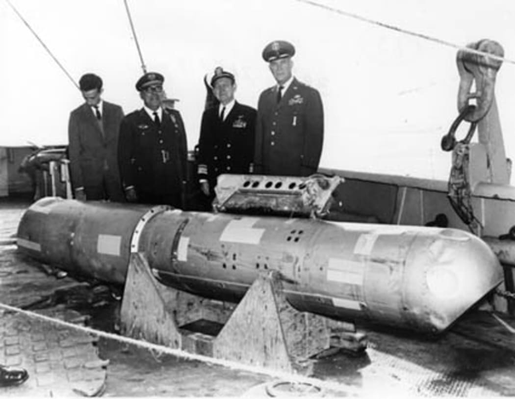 The B28RI nuclear bomb, recovered from 2,850 feet (870 m) of water, on the deck of the USS Petrel.