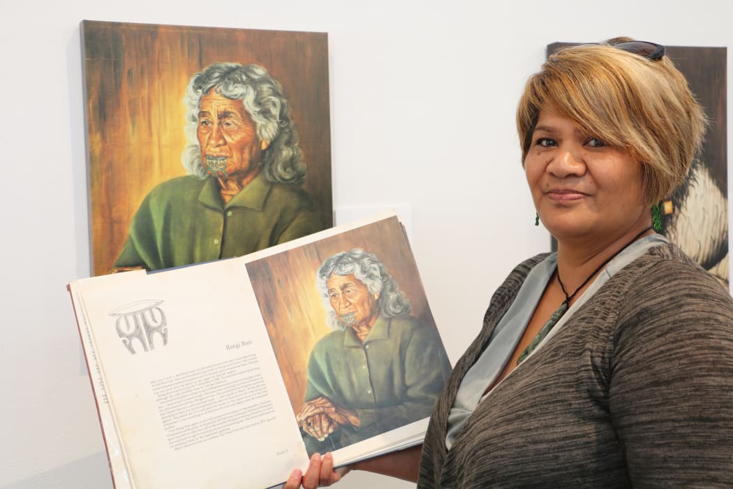 Caline Ruri-Kerr with the 1980 first edition copy of The Blue Privilege - The Last Tattooed Māori Women Te Kuia Moko.