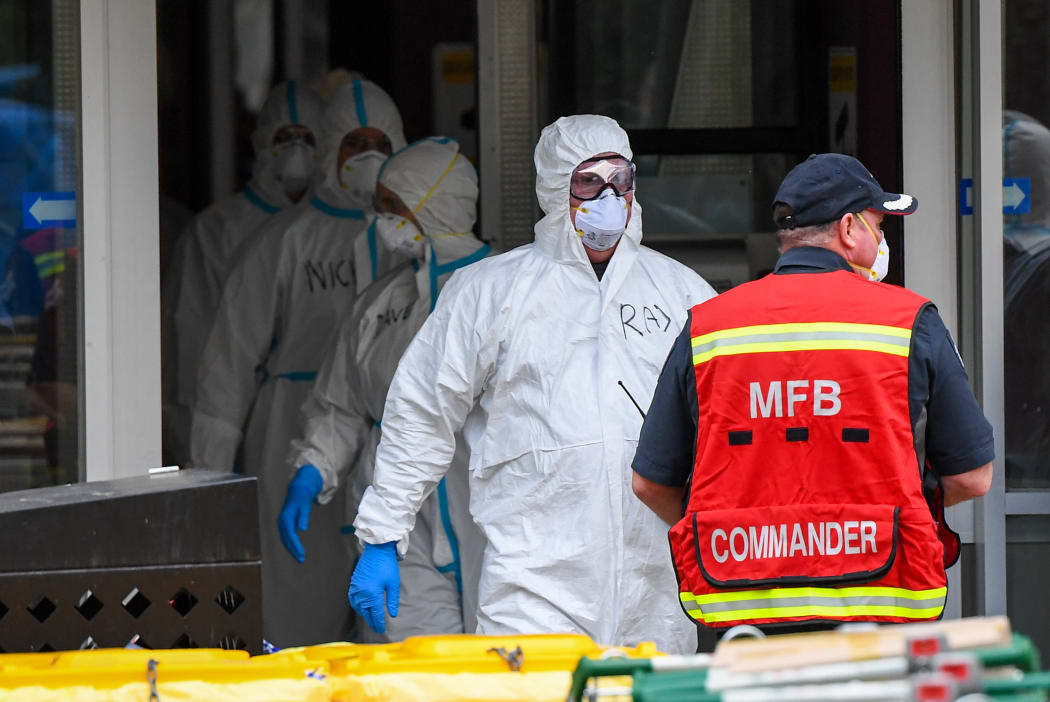 Members of the Melbourne Fire Brigade (MFB) prepare to take food parcels to residents in a locked down public housing estate in Melbourne on July 9, 2020 as the city re-enters a city wide lockdown after a fresh outbreak of the COVID-19 coronavirus.