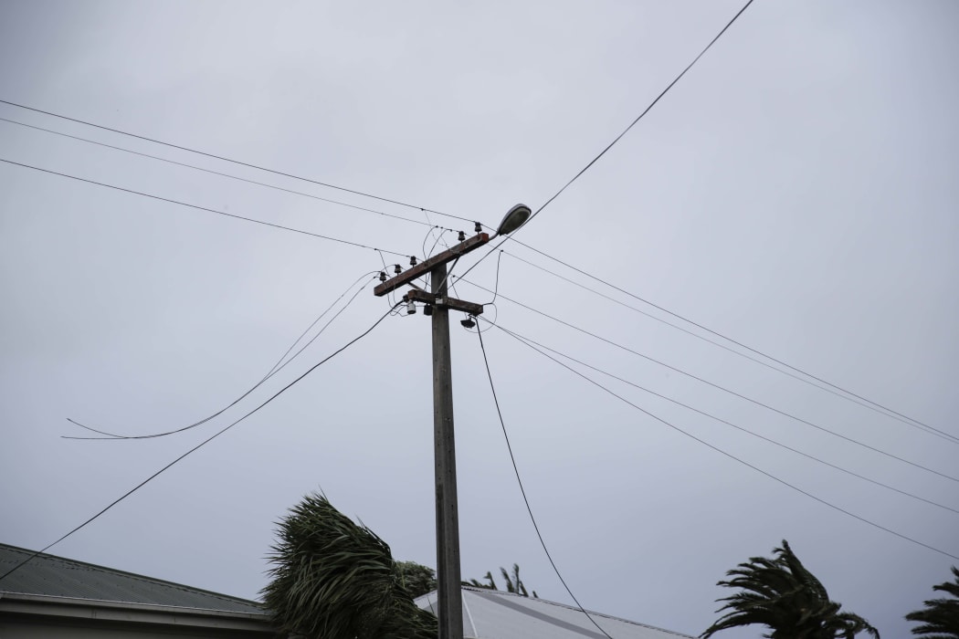 Powerlines down on Brougham St in Westport, live wires being cleared from the footpath.