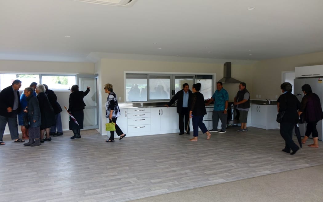 The kitchen and living area is inspected after the house was blessed.