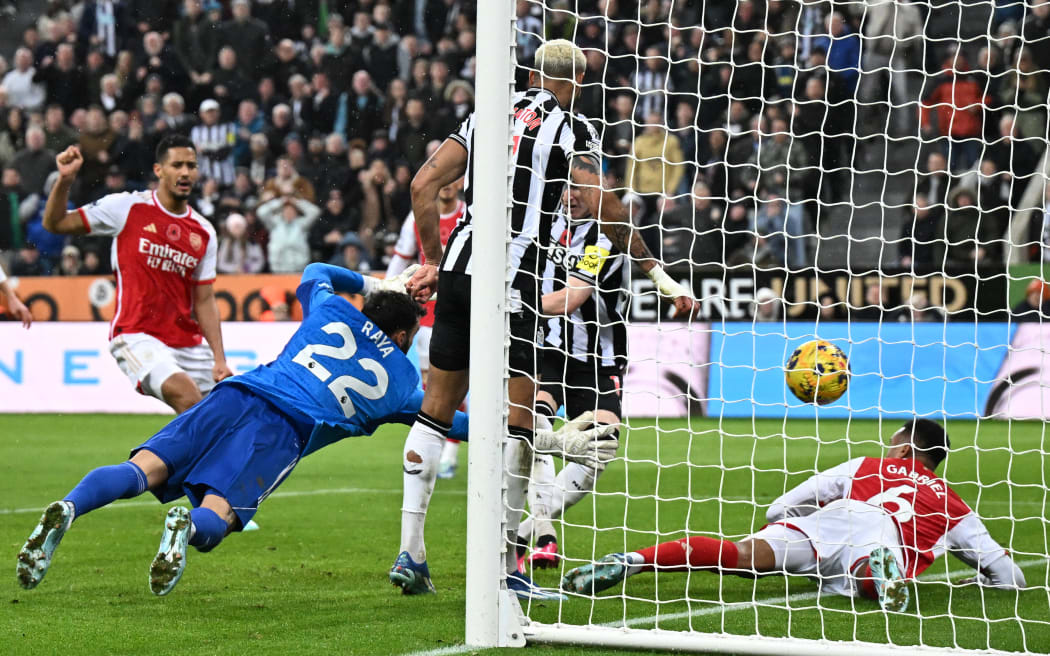 Newcastle United's Anthony Gordon shoots to score the opening goal of the English Premier League football match between Newcastle United and Arsenal at St James' Park.