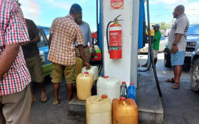 People line up at Puma energy service stations to get fuel. February 2023.