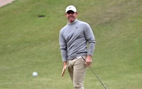 Northern Ireland's Rory McIlroy reacts after chipping onto the green during the third round of the Australian Open golf tournament at the Royal Melbourne Golf Club in Melbourne, on 6 December, 2025.