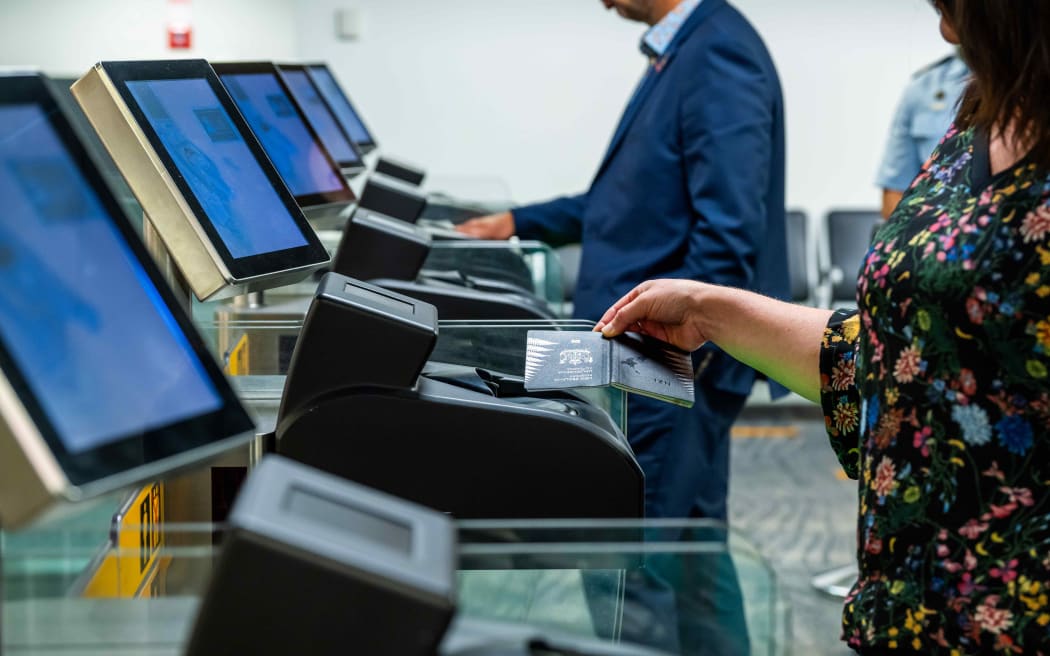 Person using an eGate at an airport.