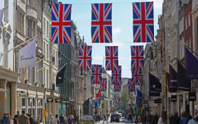 Union flags fly above Bond Street in central London, on April 29, 2023 ahead of the coronation ceremony of Charles III and his wife, Camilla, as King and Queen of the United Kingdom and Commonwealth Realm nations, on May 6, 2023. (Photo by Susannah Ireland / AFP)