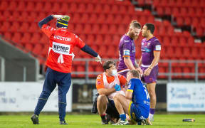 A rugby league player is checked for concussion.