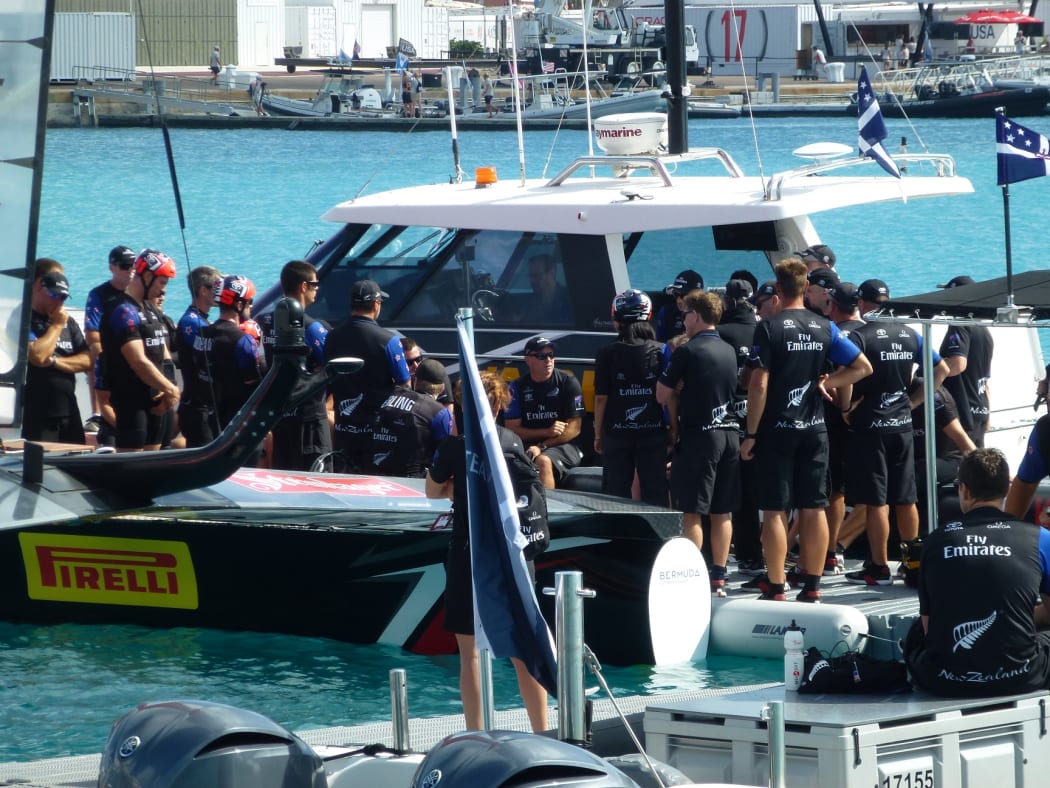 Team New Zealand having a huddle on the boat before racing starts. America's Cup, Bermuda, 2017.