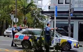 Armed police on Karangahape road.