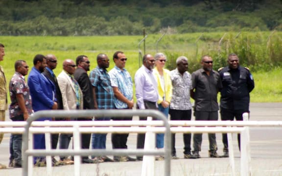 Charlot Salwai boarding an Australian Defence Force plane to survey damage to Vanuatu caused by Cyclone Lola.