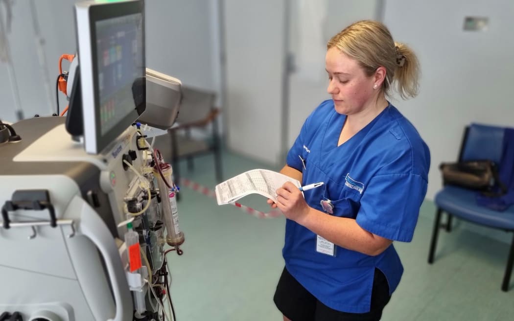 Taranaki Base Hospital nurse with an acute kidney dialysis machine