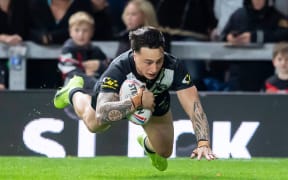 New Zealand's Charnze Nicoll-Klokstad scores a try against Leeds.