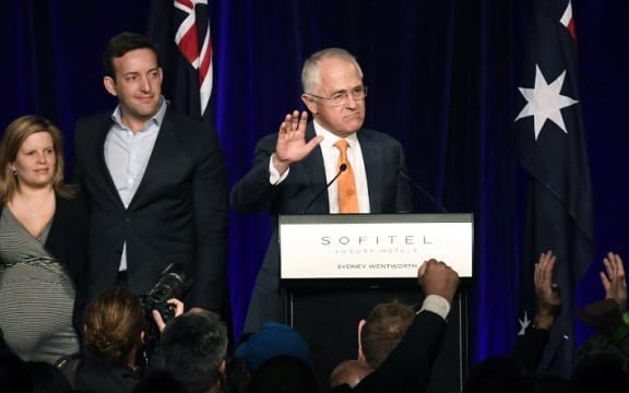 Prime Minister Malcolm Turnbull (C) is watched by his family as he speaks at a Liberal party function in Sydney on July 3, 2016, in a tense wait for a result in Australia's general election.