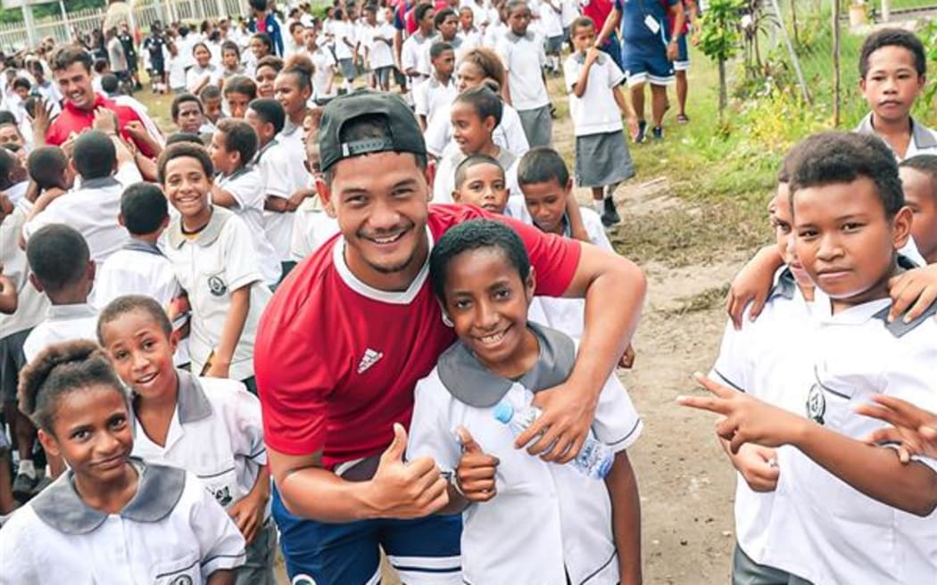 Tahiti United players get to meet students of Wardstrip Demonstration Primary School in Port Moresby during their community visitation on Thursday.