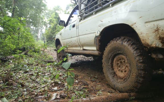 15205812 - closeup of 4x4 car driving uphill with mud