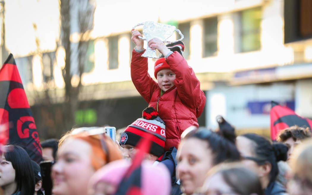 Crusaders fans celebrate their team's win on the streets of Christchurch