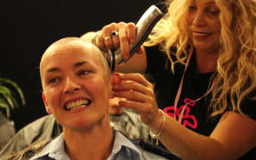 A Kerikeri police officer has her head shaved as part of the 2015 world record head-shaving event.