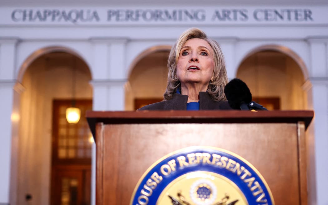 Former US Secretary of State Hillary Clinton speaks to the press after her a deposition with the House Oversight Committee as they investigate links to convicted sex offender Jeffrey Epstein, in Chappaqua, New York, on February 26, 2026. Clinton testified behind closed doors on Thursday before a congressional committee investigating the late convicted sex offender Jeffrey Epstein and his accomplice Ghislaine Maxwell. Former president Bill Clinton is scheduled to answer questions the following day from the Republican-led House Oversight Committee about his relations with Epstein, who died in a New York jail cell in 2019 while awaiting trial. (Photo by CHARLY TRIBALLEAU / AFP)