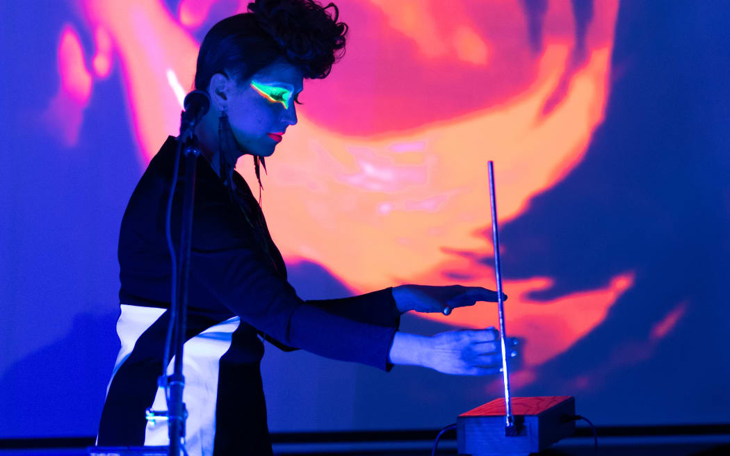 Henika playing the theremin