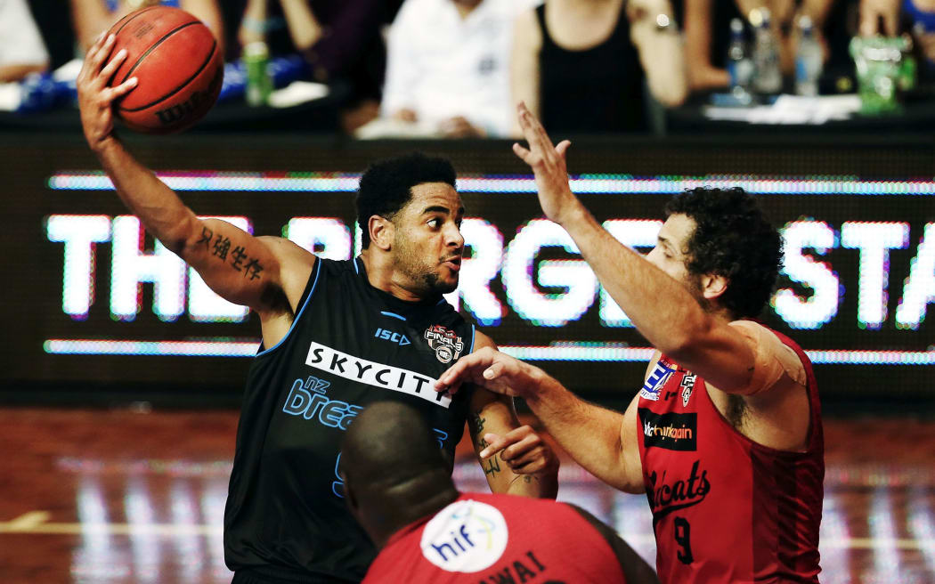 Corey Webster of the Breakers looks to make a pass against Matty Knight of the Wildcats.