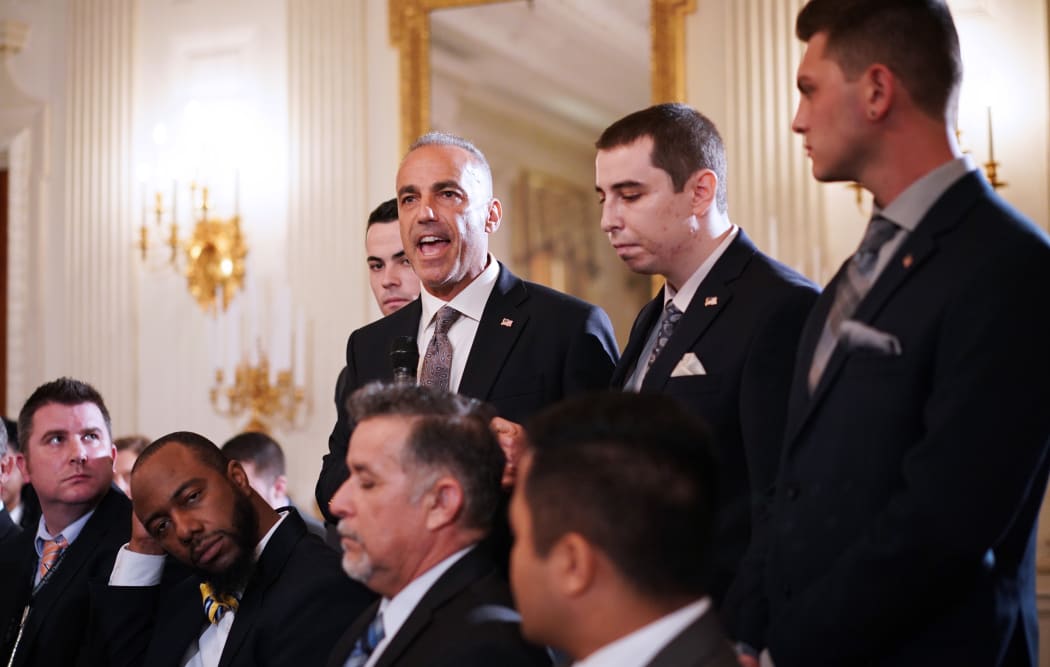 Andrew Pollack, flanked by his sons, speaks during Donald Trump's listening session on gun violence