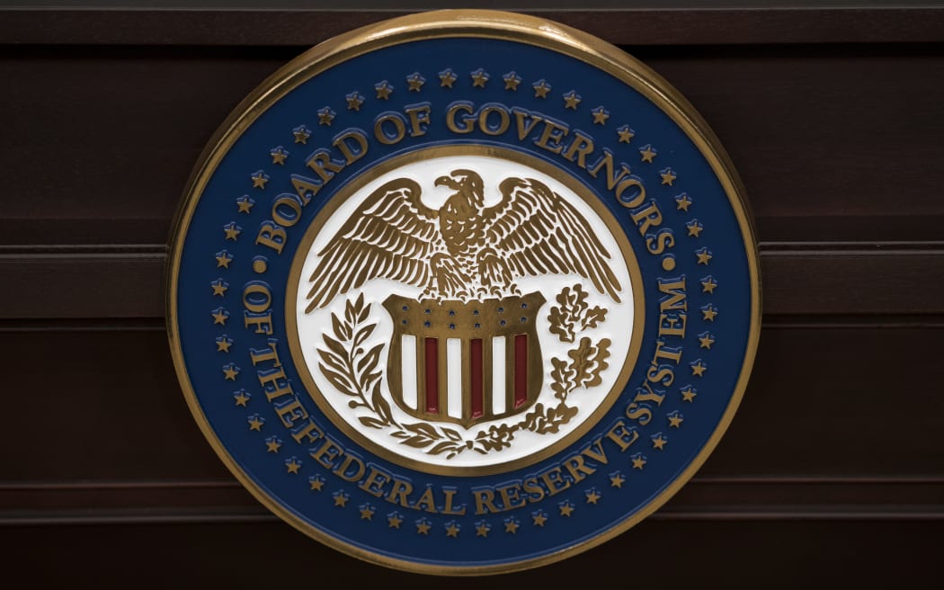 The US Federal Reserve seal. AFP PHOTO/BRENDAN SMIALOWSKI