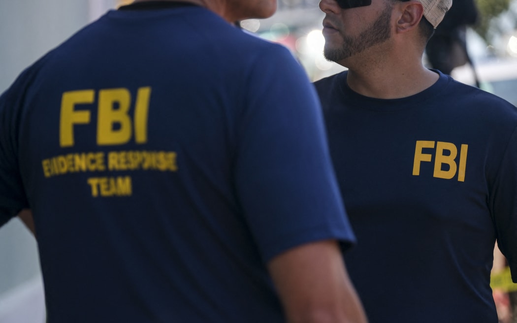 Members of the FBI are seen as they work with French authorities to conduct a raid to recover art at the headquarters of the Michele Vasarely Foundation in San Juan, Puerto Rico, on April 11, 2023. - The raid, according to local sources, is related to an investigation into the whereabouts of hundreds of works of art by French-Hungarian artist Victor Vasarely and his son Yvaral Vasarely, valued at more than $40 million dollars. (Photo by Ricardo ARDUENGO / AFP)