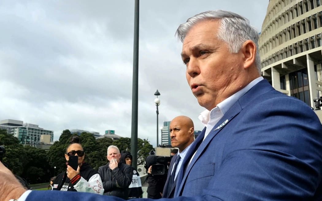 National MP Mark Mitchell confronts gang whānau on Parliament's forecourt.