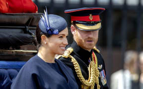 Prince Harry and Meghan, Duke and Duchess of Sussex drive to Buckingham Palace in London, on June 08, 2019, after  attending Trooping the Colour