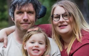 Invercargill man Michael Cockroft, who has motor neurone disease, with his wife Lara and their daughter Charlie-Louise