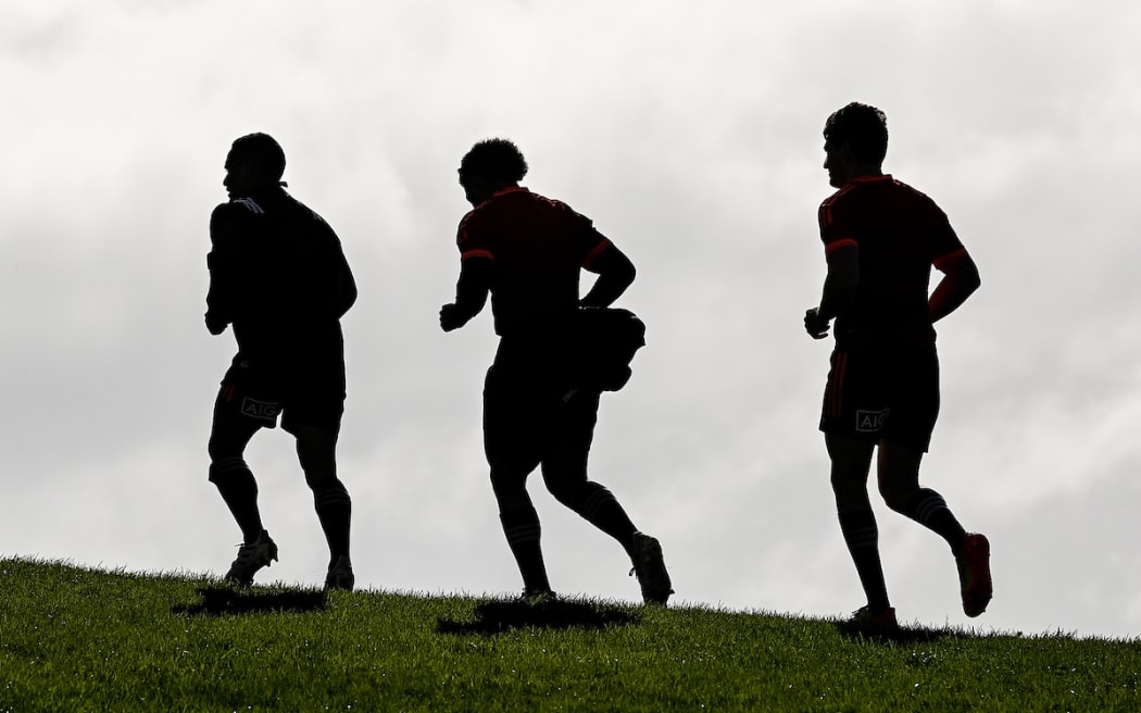 Aaron Smith, Richie Mo'unga and Beauden Barrett after an All Blacks training session on 29 June ahead of the test match against Tonga.