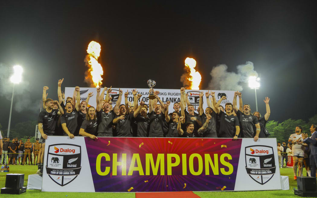 The NZ U85kg side celebrate with the Sir Graham Henry Trophy.