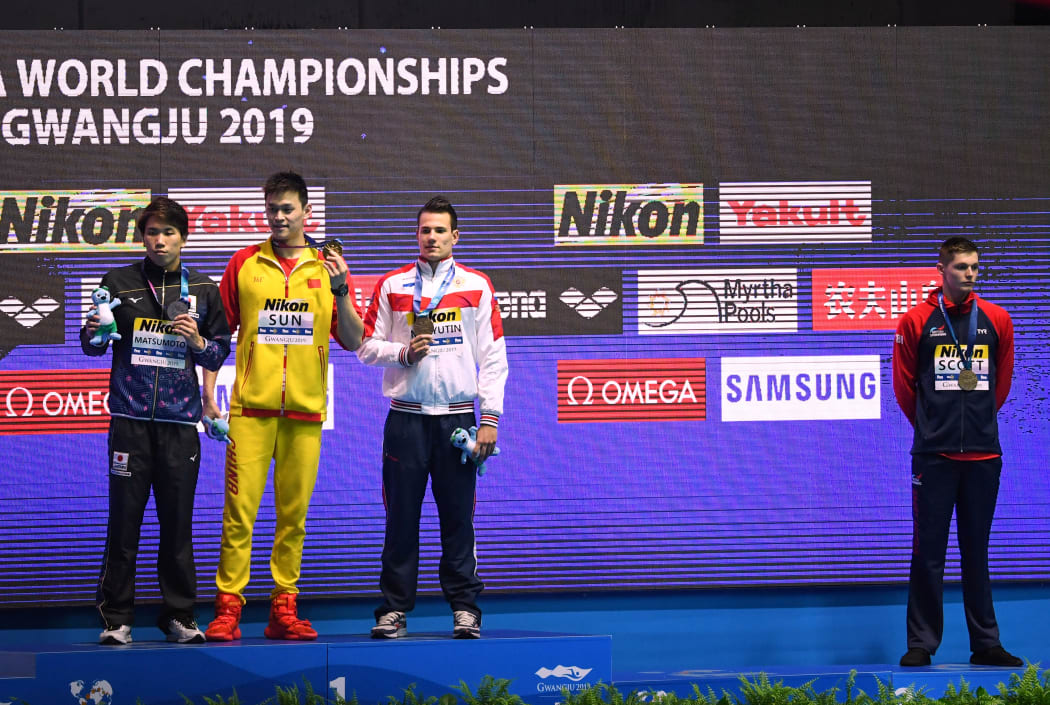 (From left) silver medallist Katsuhiro Matsumoto, gold medallist Sun Yang and tie bronze medallist Martin Malyutin pose as tie bronze medallist Duncan Scott stands aside after the final of the men's 200m freestyle at the 2019 World Championships in South Korea.