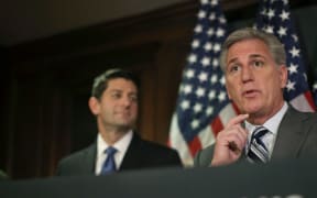 US House Majority Leader Kevin McCarthy, right, speaks to the media while flanked by House Speaker Paul Ryan in Washington on 3 November.