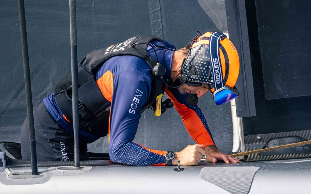 Ben Ainslie getting into his cockpit after race three of at the Louis Vuitton 37th America’s Cup in Barcelona, Spain.