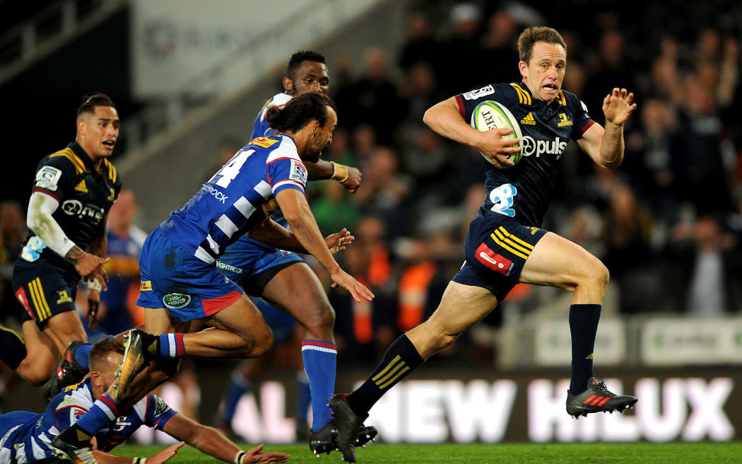 Ben Smith of the Highlanders makes a break, during the Super Rugby match between the Highlanders and the Stormers.