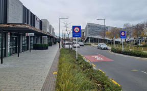 Tennyson Street in Rolleston's Town Centre, with shops and eateries on the left and Te Ara Ātea, a Selwyn District Library and community hub on the right.