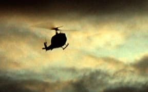 A helicopter flying in cloudy weather