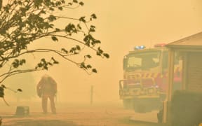A firefighter at Balmoral, 150km south-west of Sydney, 19 December.