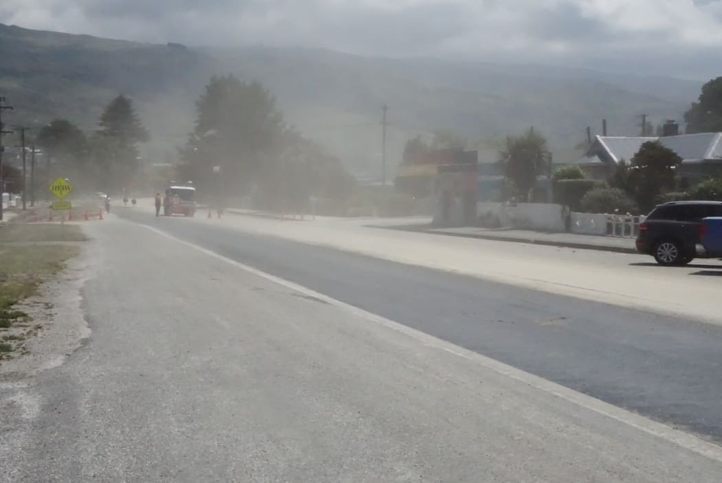 Dust covered the town of Roxburgh today as residents shored up after flash floods and ahead of more rain.