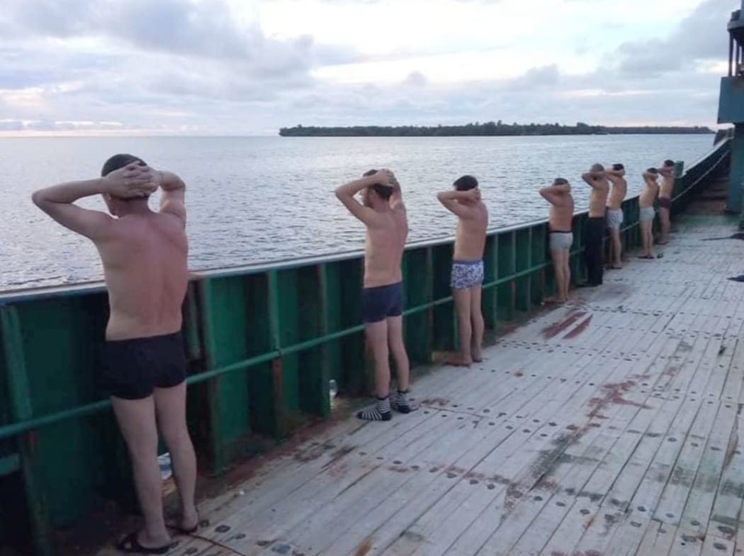 Foreign crew are detained off ship suspected of carrying out illegal activities